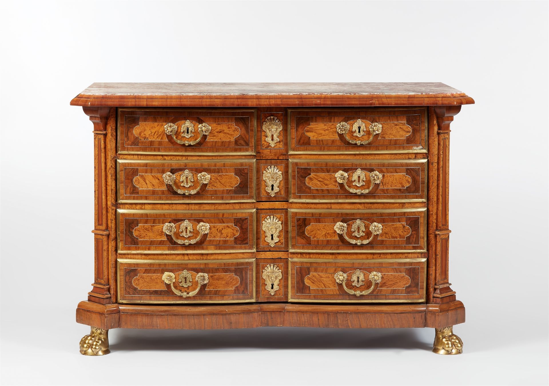 A Régence walnut chest of drawers with corner pilasters