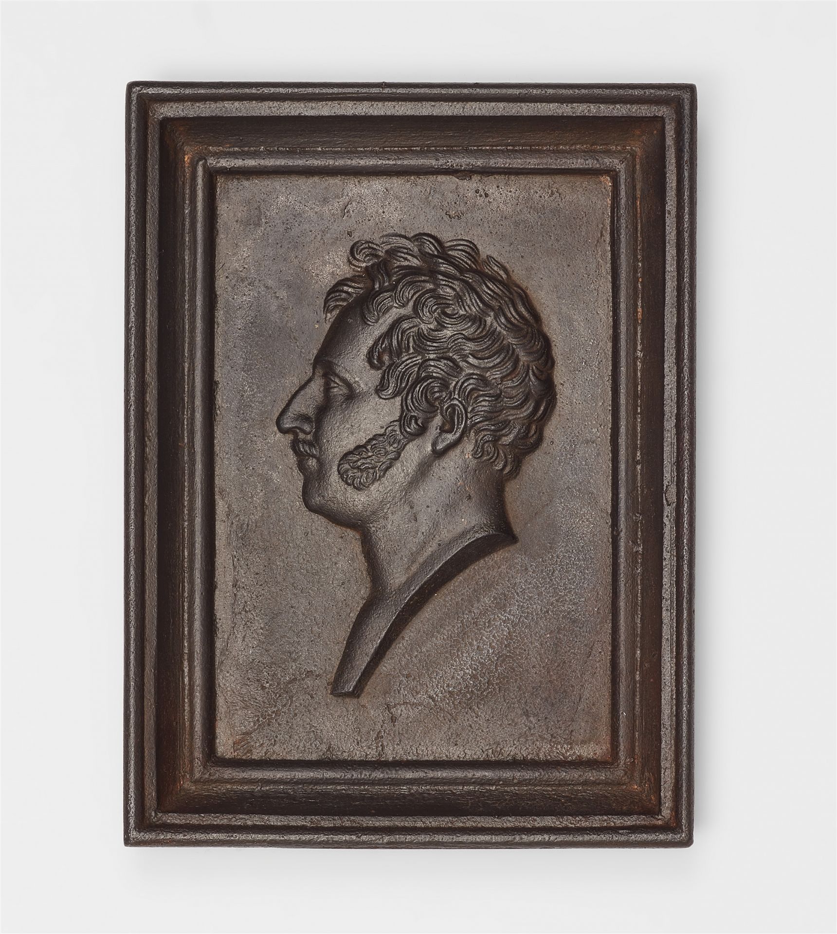 A cast iron plaque with a portrait of King Wilhelm I of Württemberg