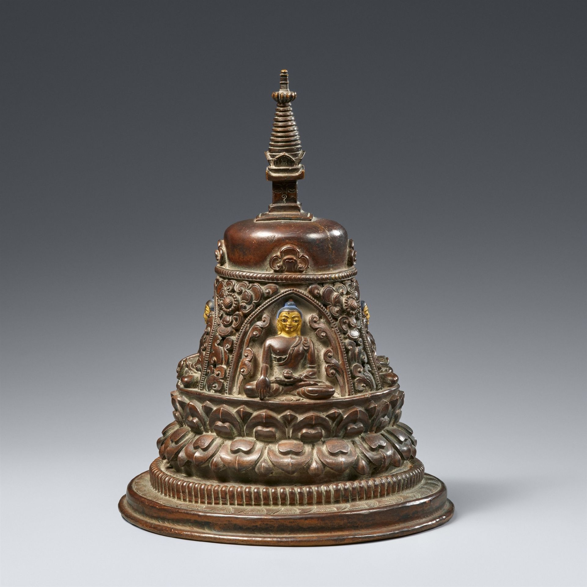 A Nepalese dark patinated copper stupa