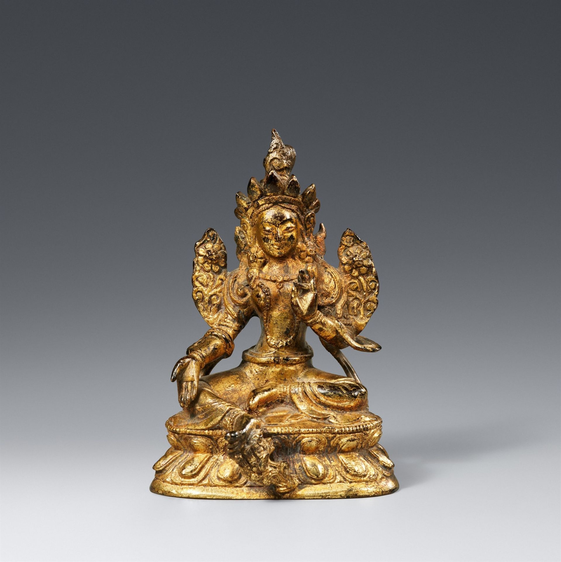 A Tibetan gilt bronze figure of the Green Tara (Shyamatara). 19th/20th century