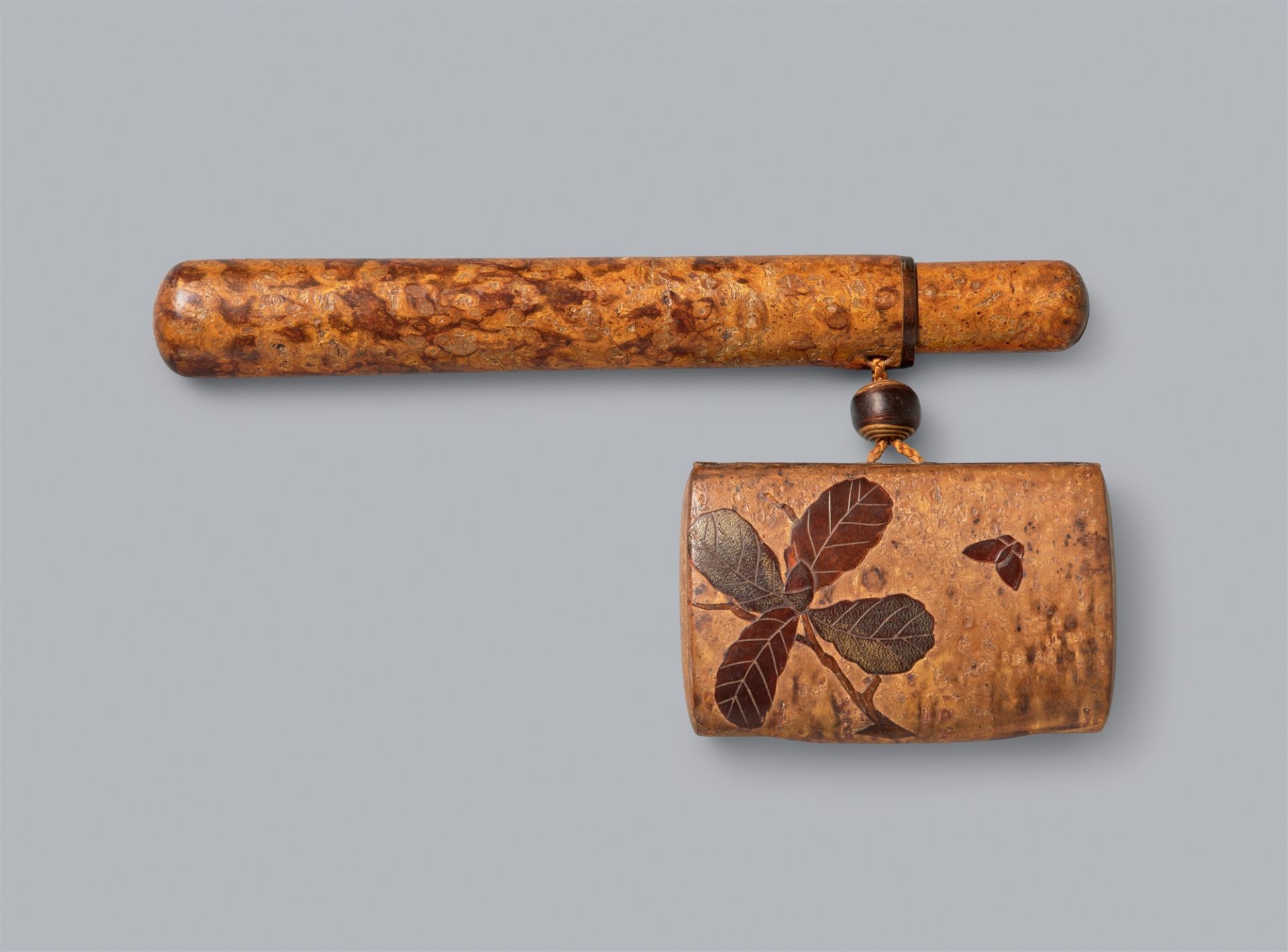 A smoking set of cherry bark. Around 1900