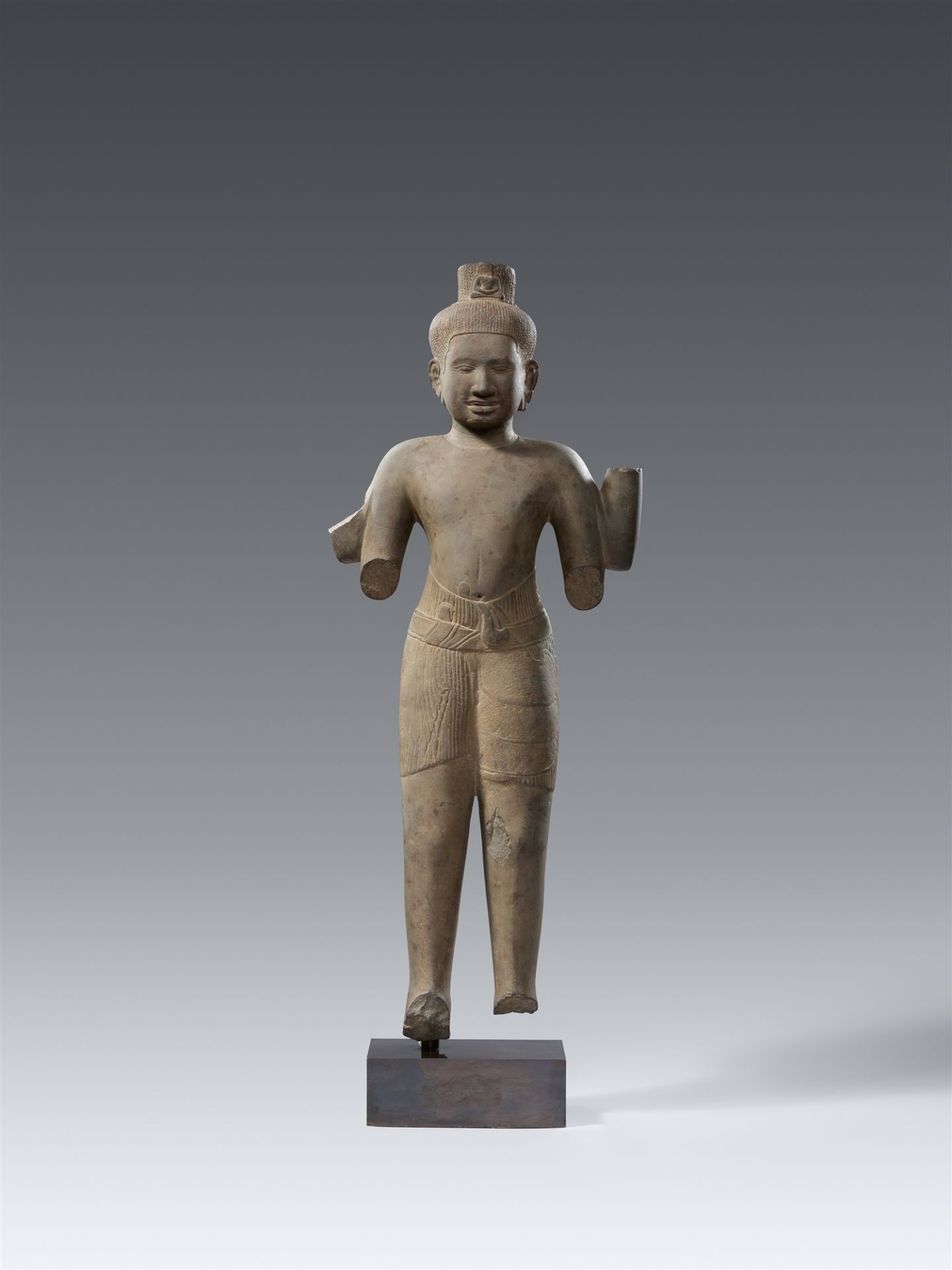 A gray sandstoe Baphuon-style figure of a Lokeshvara. Second half 11th century