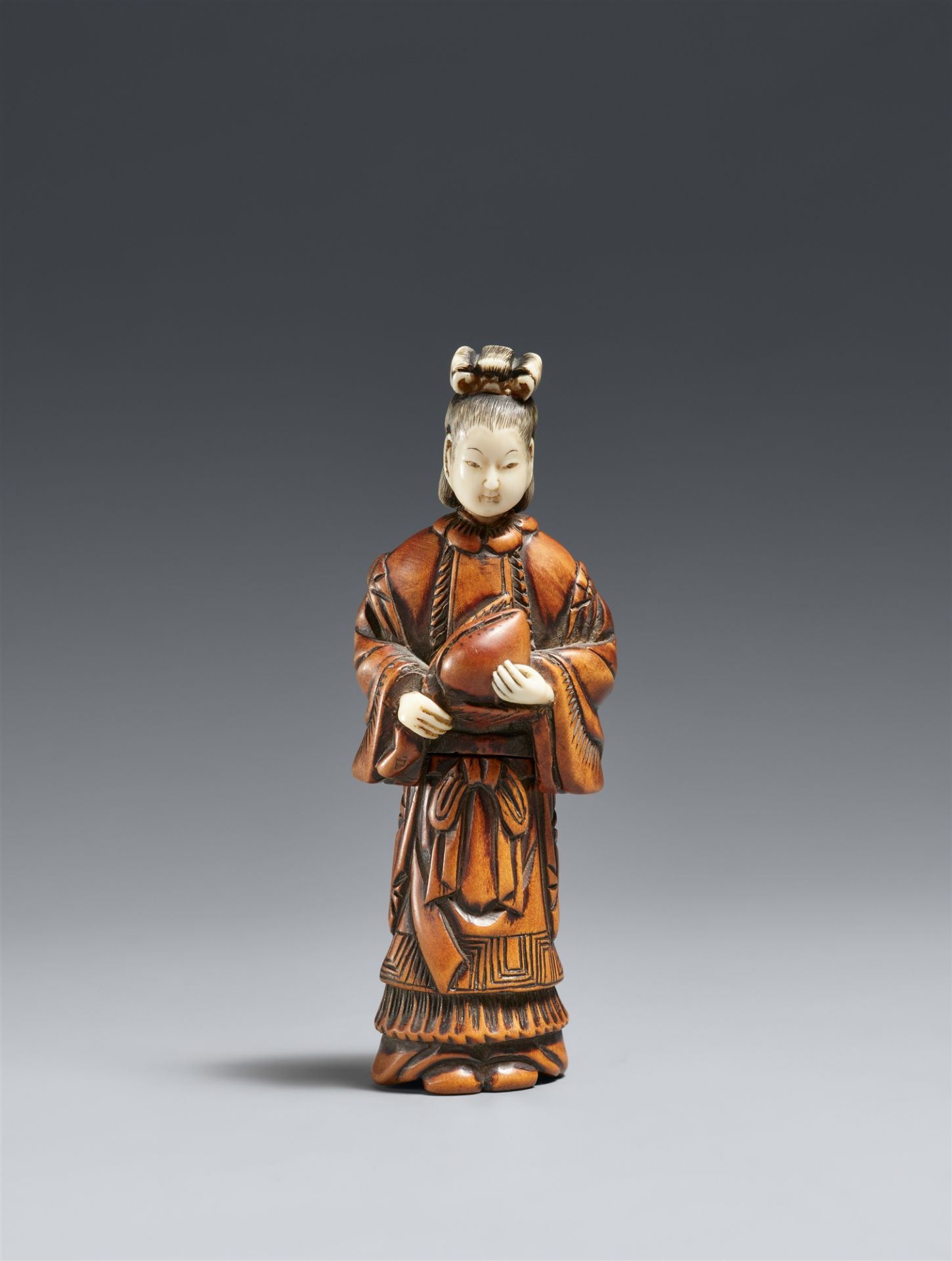 A boxwood and ivory shunga netsuke of Seiôbô. 19th century