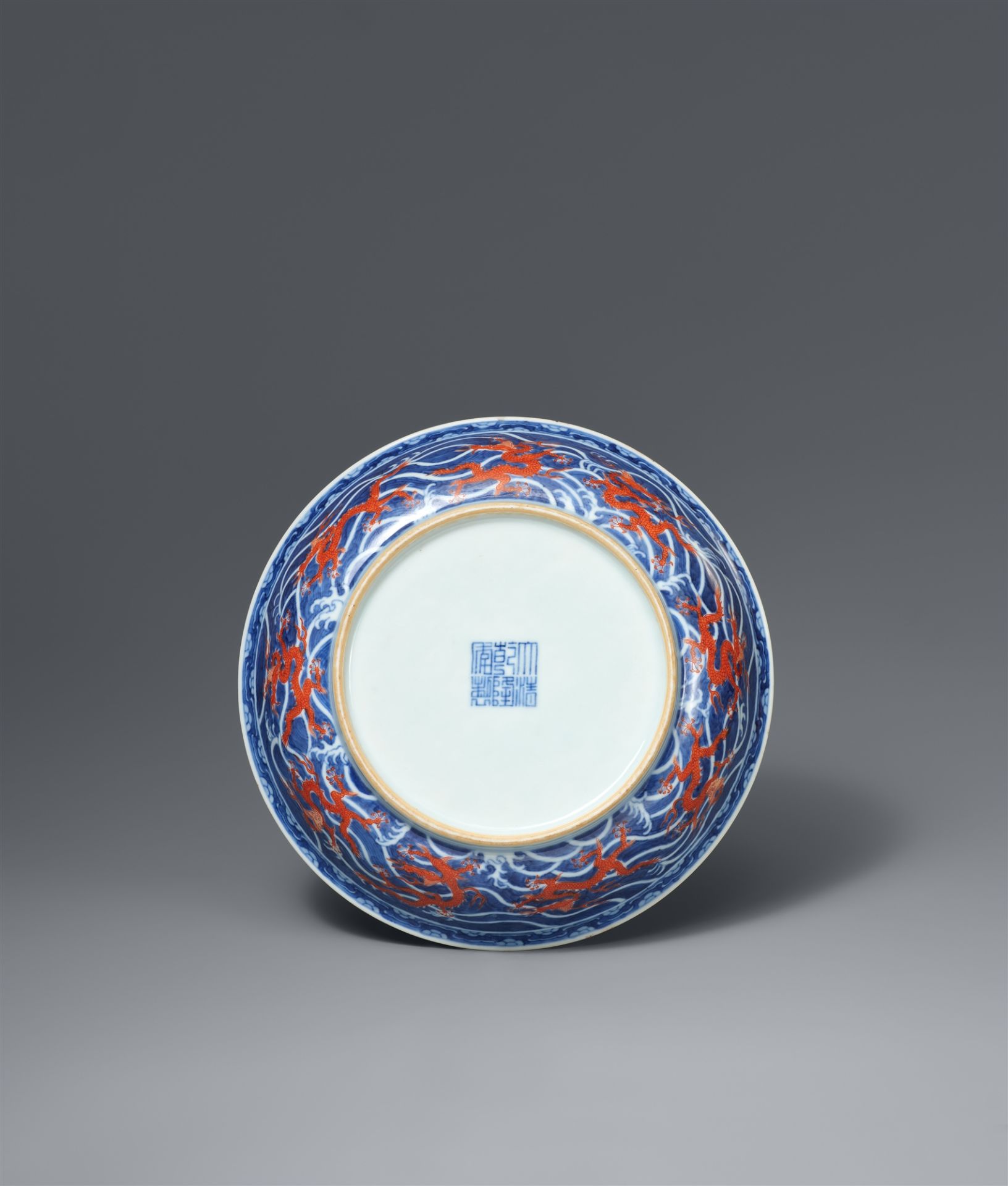 An imperial underglaze-blue and iron-red dragon dish. Qianlong six-character mark in underglaze-blue - Image 2 of 4