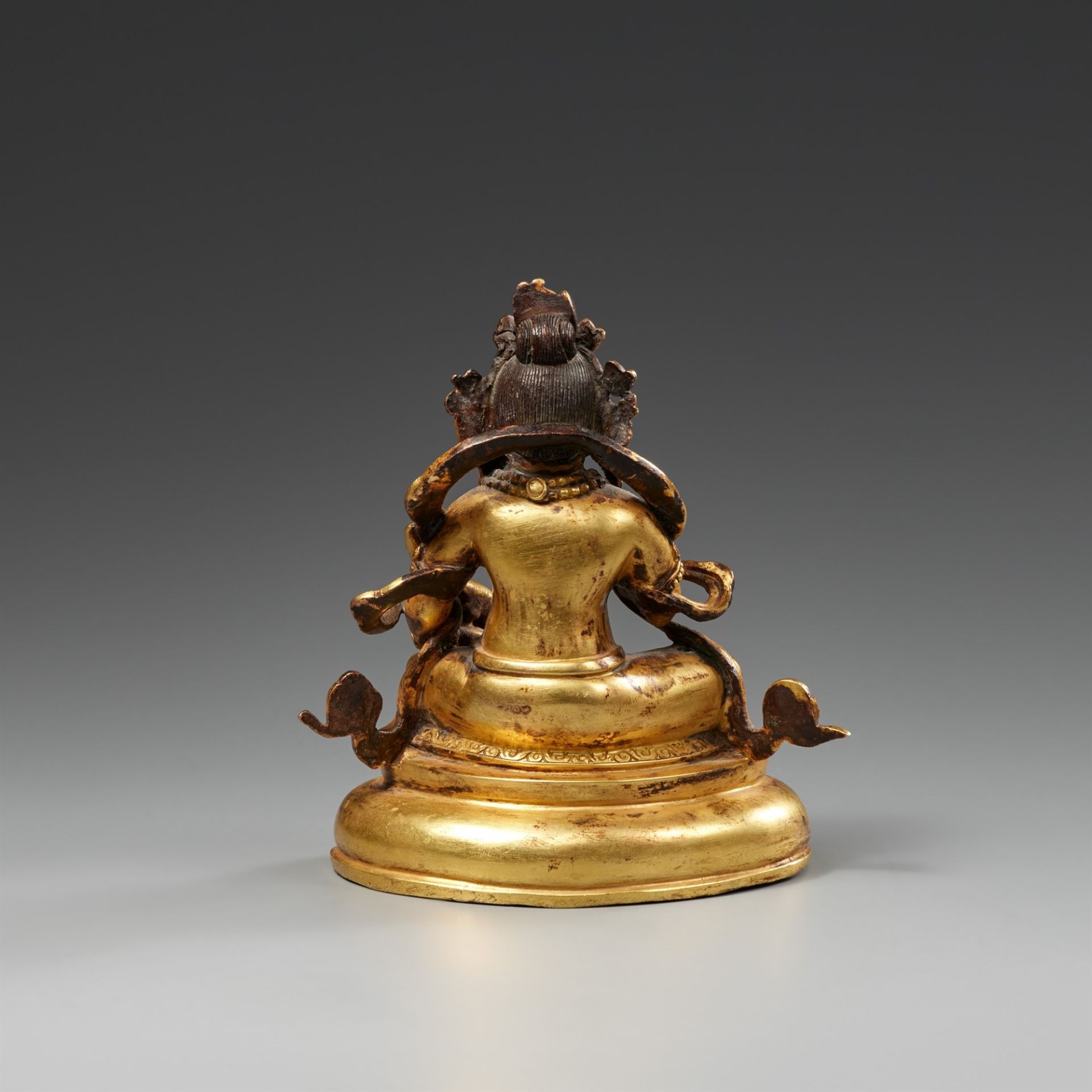 A fire-gilt bronze of Jambhala. 19th/20th century - Image 2 of 2