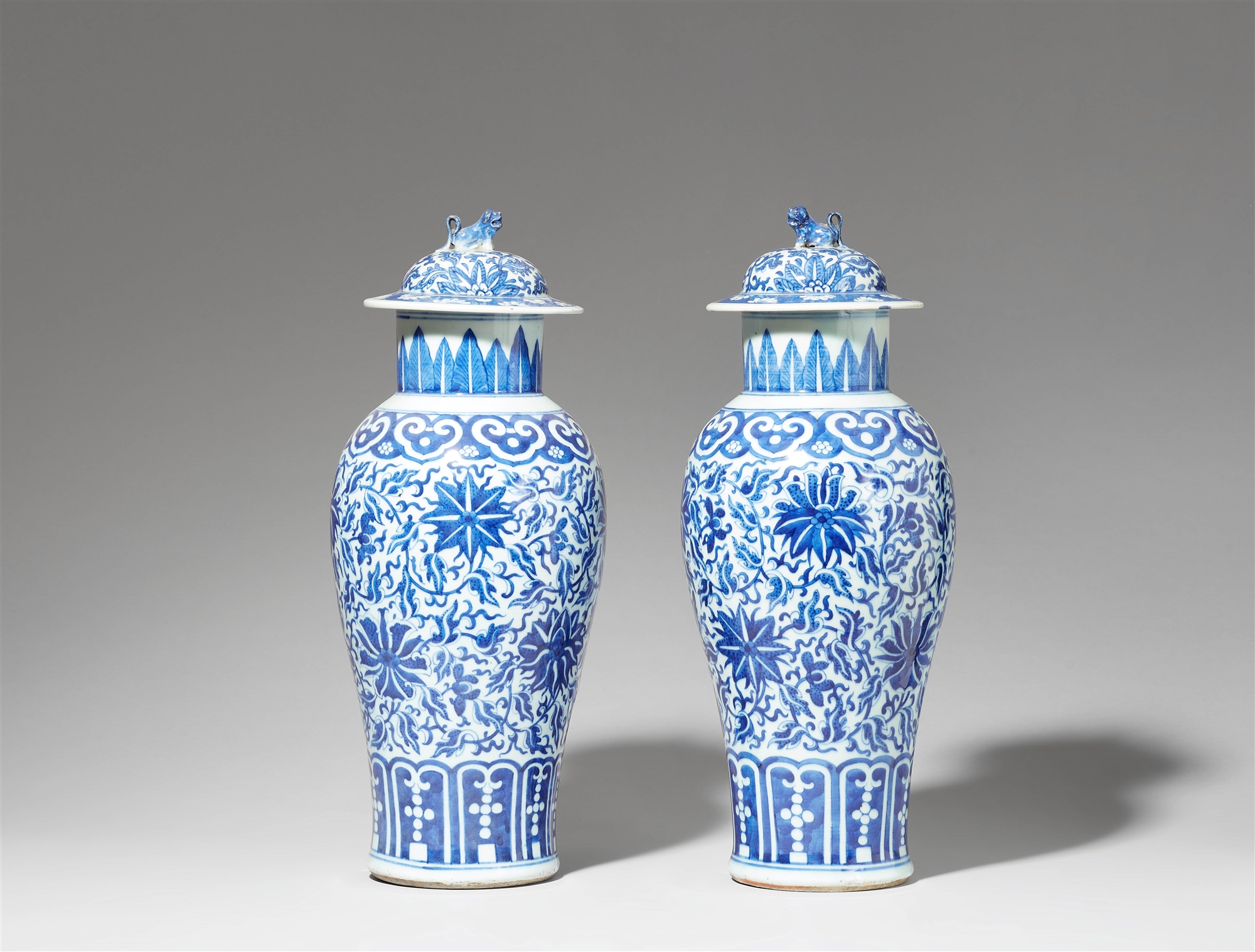 A pair of blue and white lidded baluster vases. Qing dynasty, 19th century