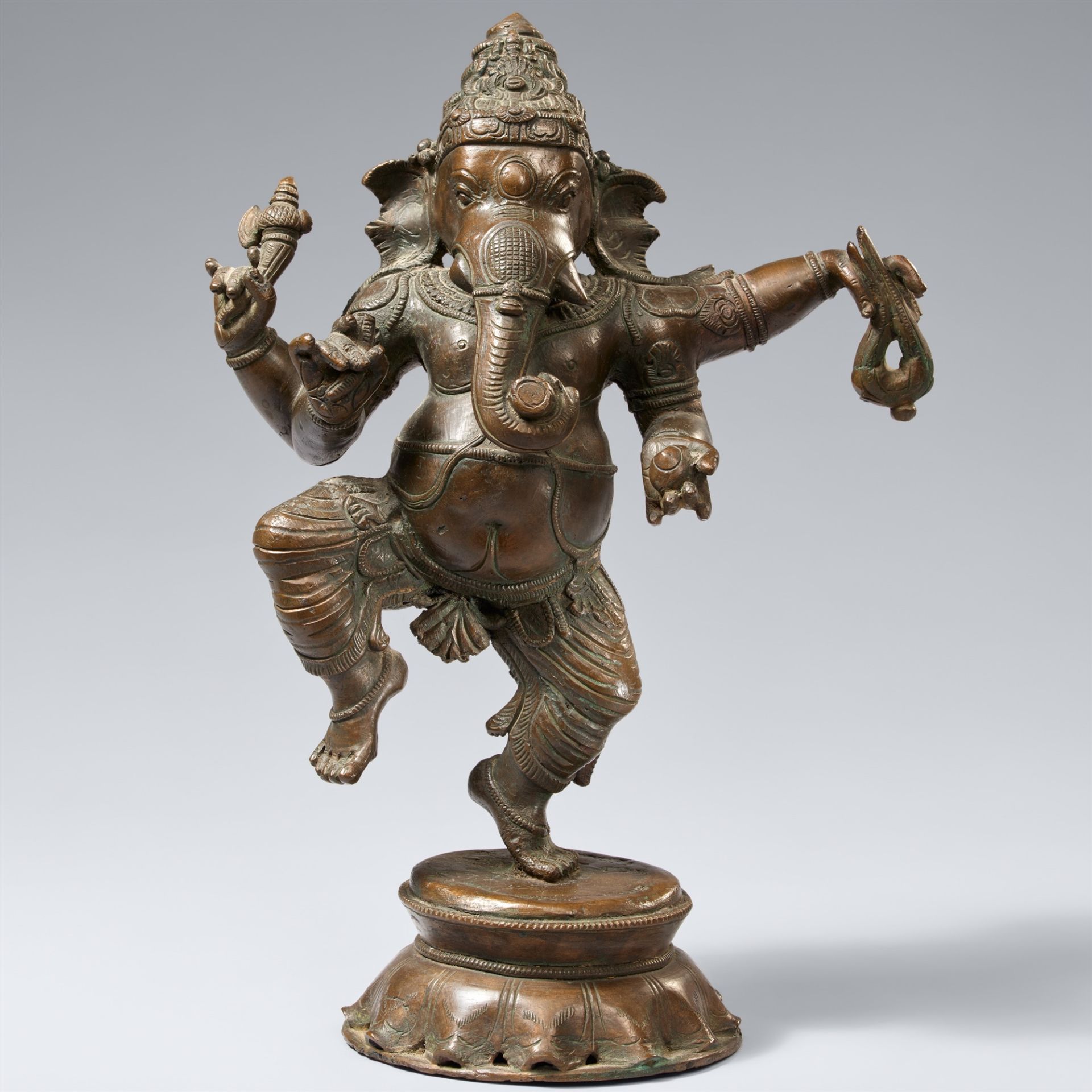 A South Indian bronze figure of a dancing Ganesha. 19th century