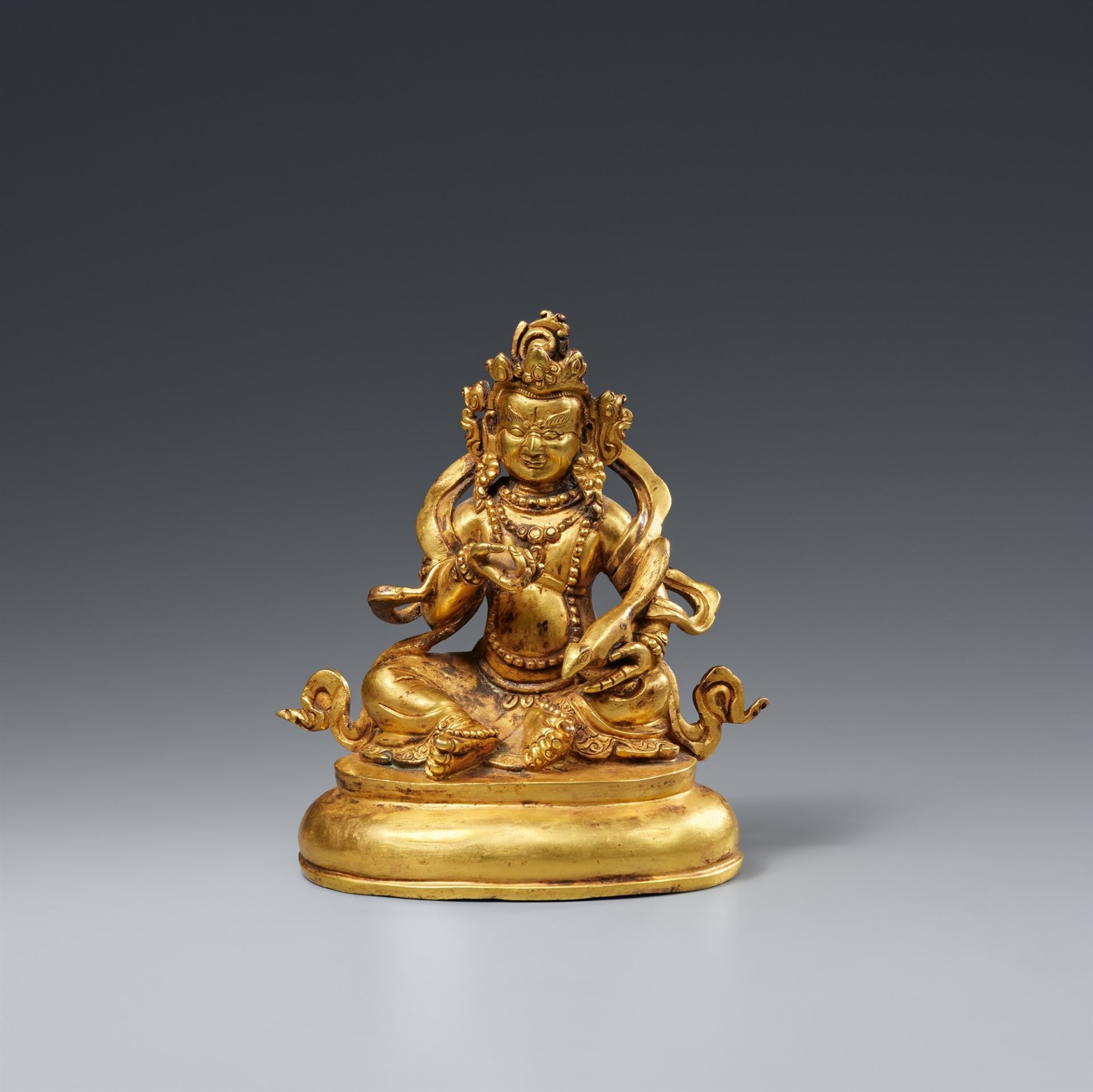 A fire-gilt bronze of Jambhala. 19th/20th century