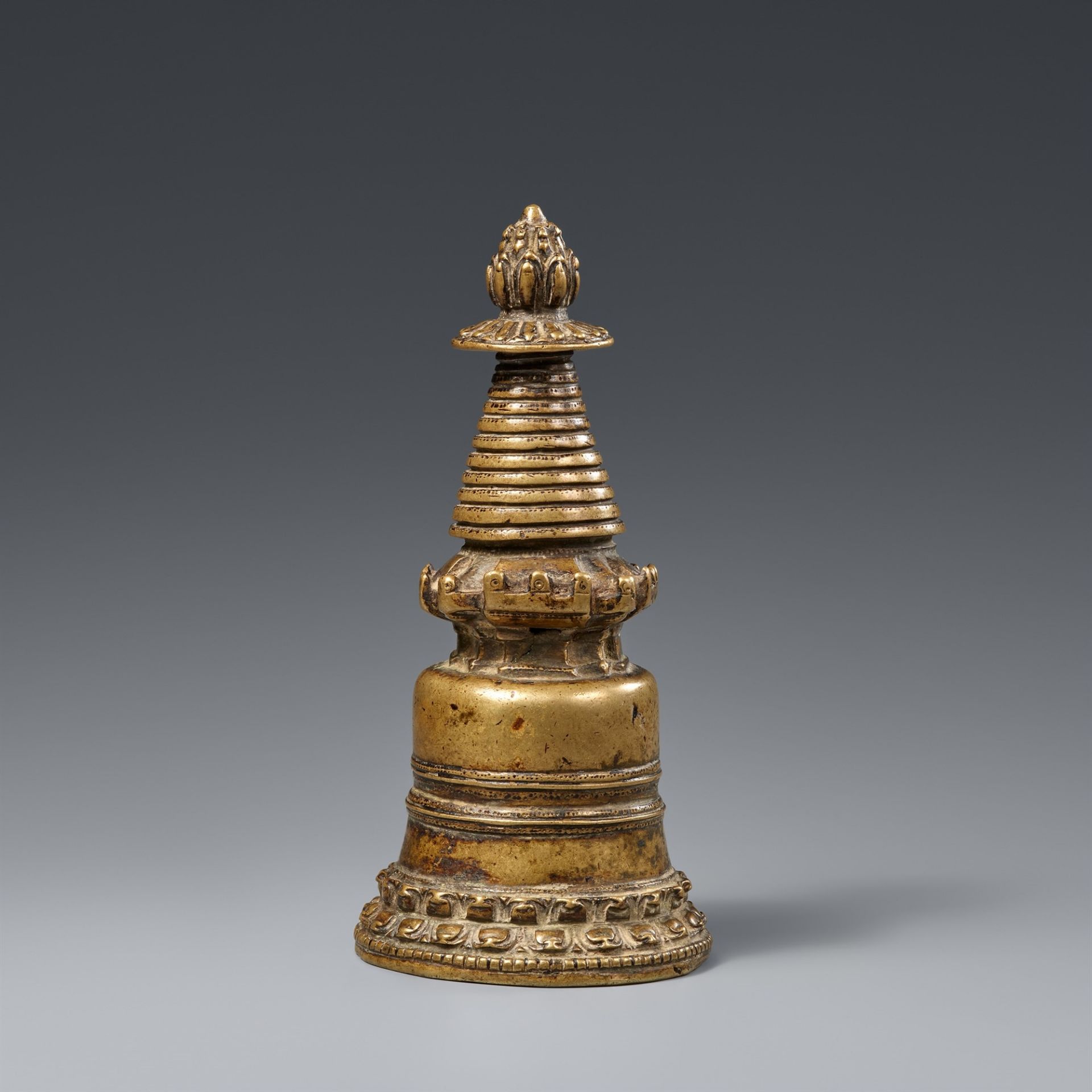 A Tibetan brass kadampa-stupa. 13th century