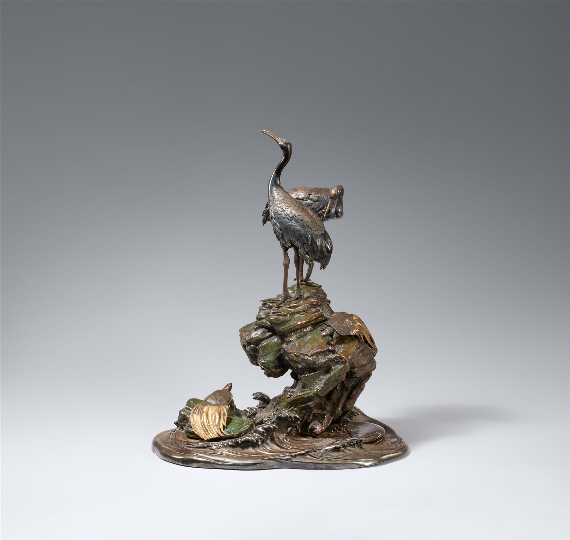 A bronze and silver okimono of a pair of cranes and two tortoises. Late 19th century