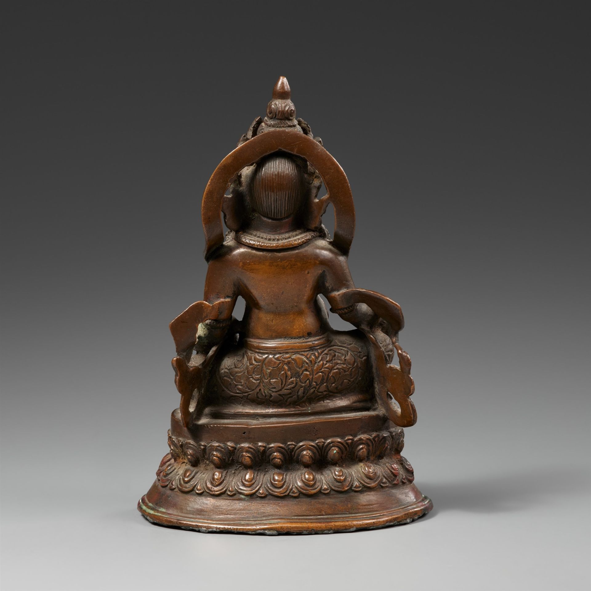 A Tibetan bronze figure of Jambhala. 19th/20th century - Image 2 of 2