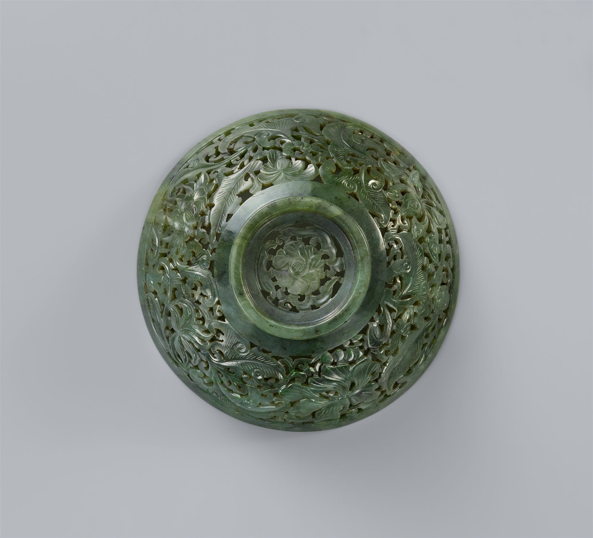 A spinach-green jade cover of a bowl. 18th/19th century