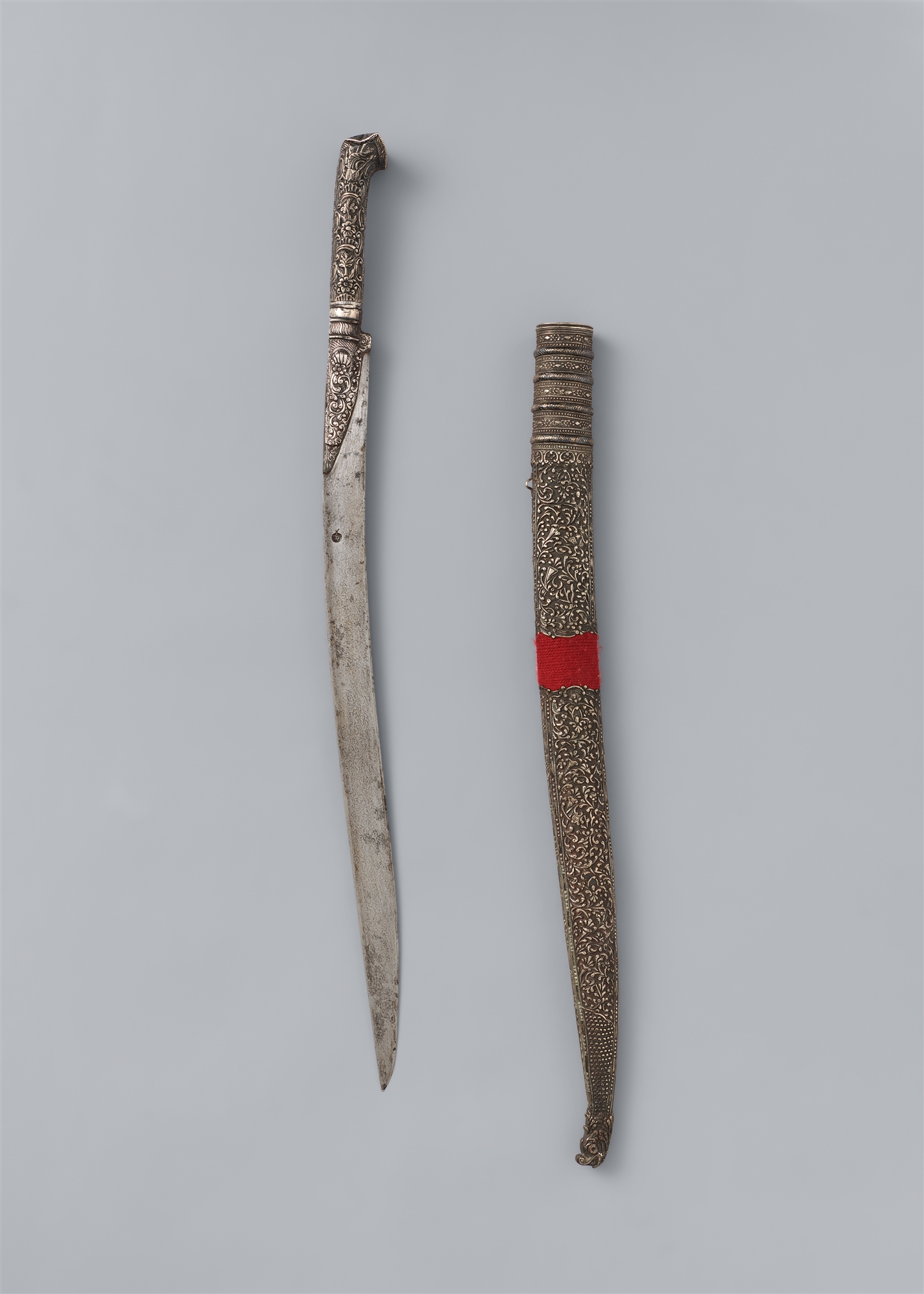 An Ottoman silver-mounted yatagan with scabbard. 19th century