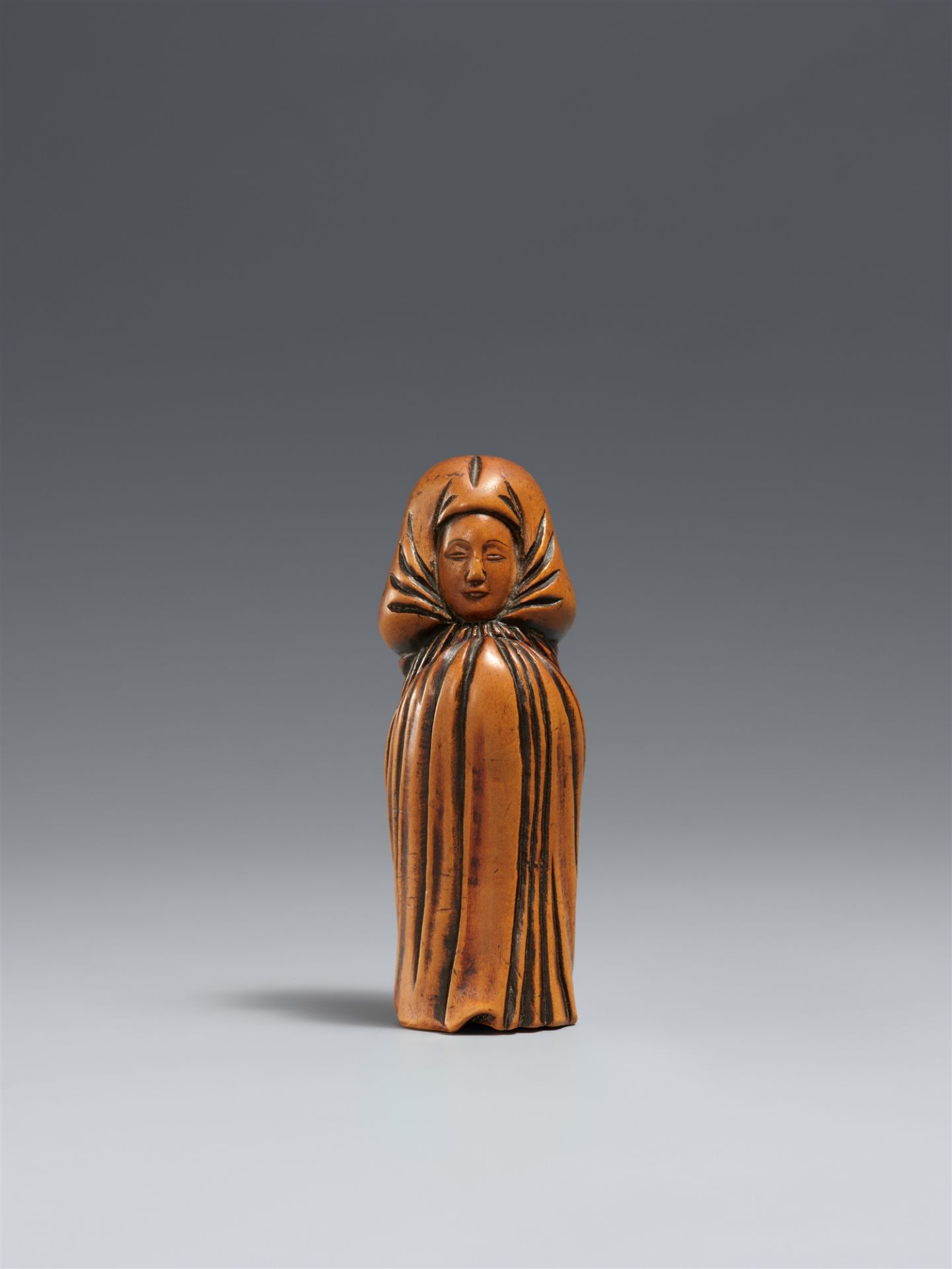 A boxwood and ivory shunga netsuke. 19th century