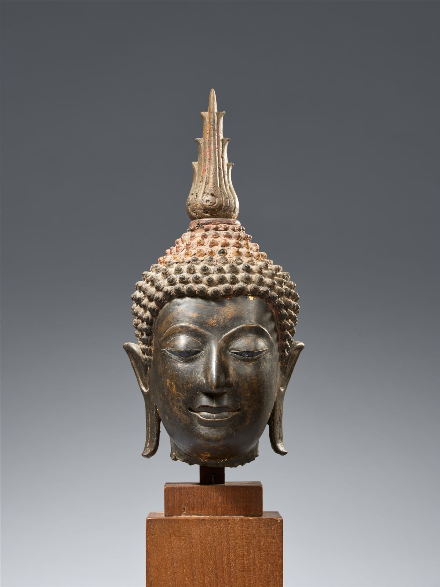 A Sukhothai bronze head of a Buddha. Thailand. 14th/15th century