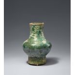 A green-glazed Hu vase. Han dynasty (206 BCE - 220 CE)