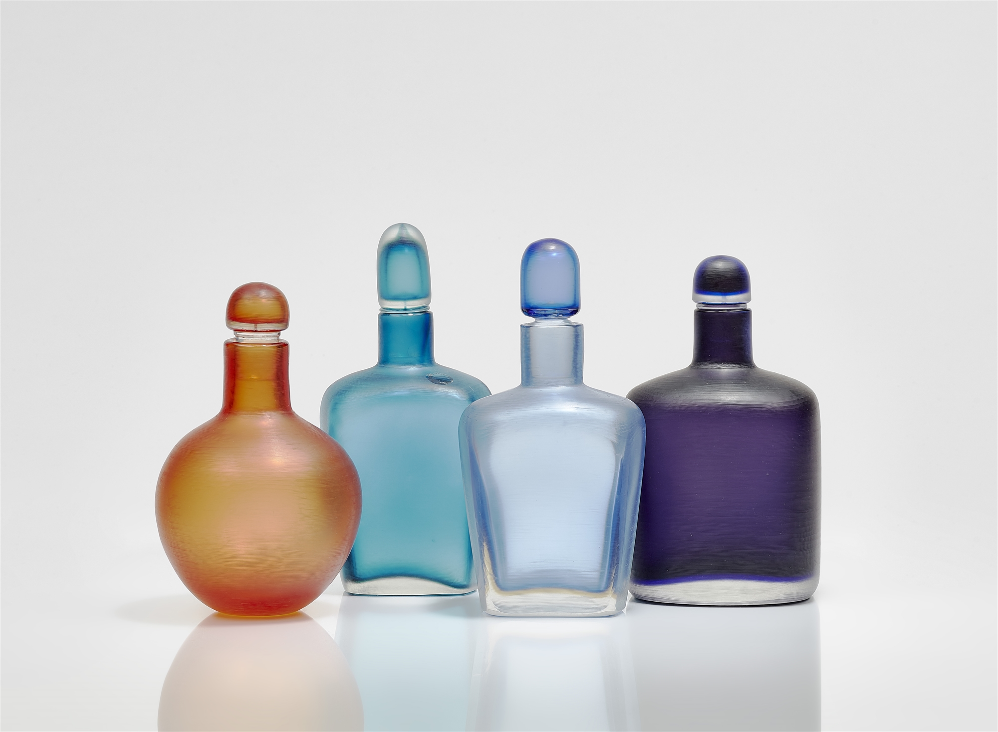 Four 'Inciso' bottles, Venini & C., Murano, designed by Paolo Venini 1950s, produced in the 1960s an
