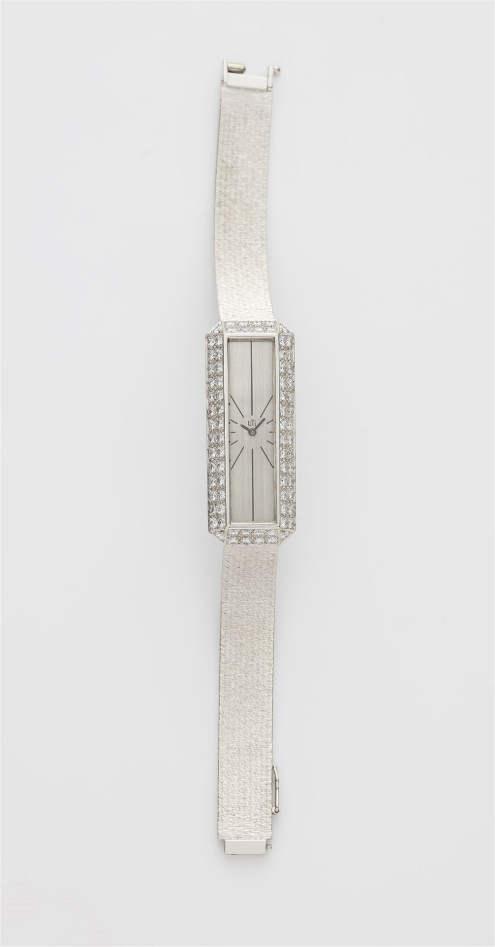 An 18k white gold and diamond manually wound Utinam ladies wristwatch.