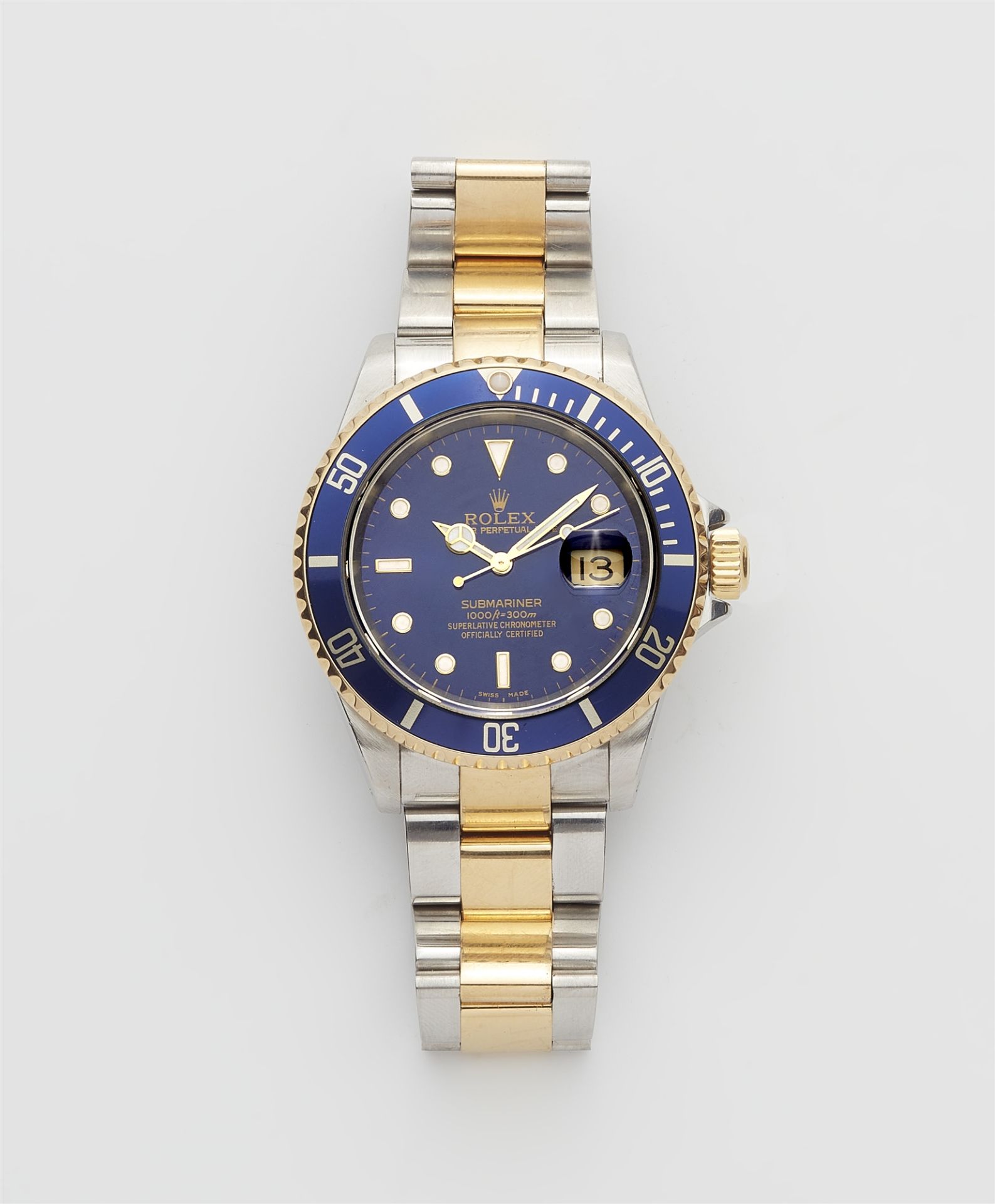 An 18k and stainless steel automatic Rolex Submariner gentleman´s wristwatch.