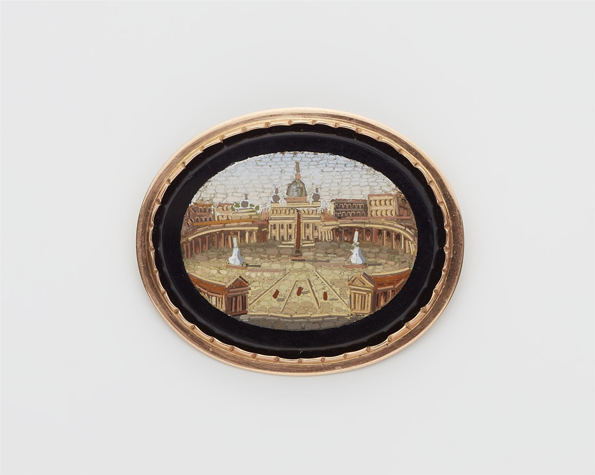 A 14k gold and Roman micromosaic brooch depicting the St. Peters Square in Rome.
