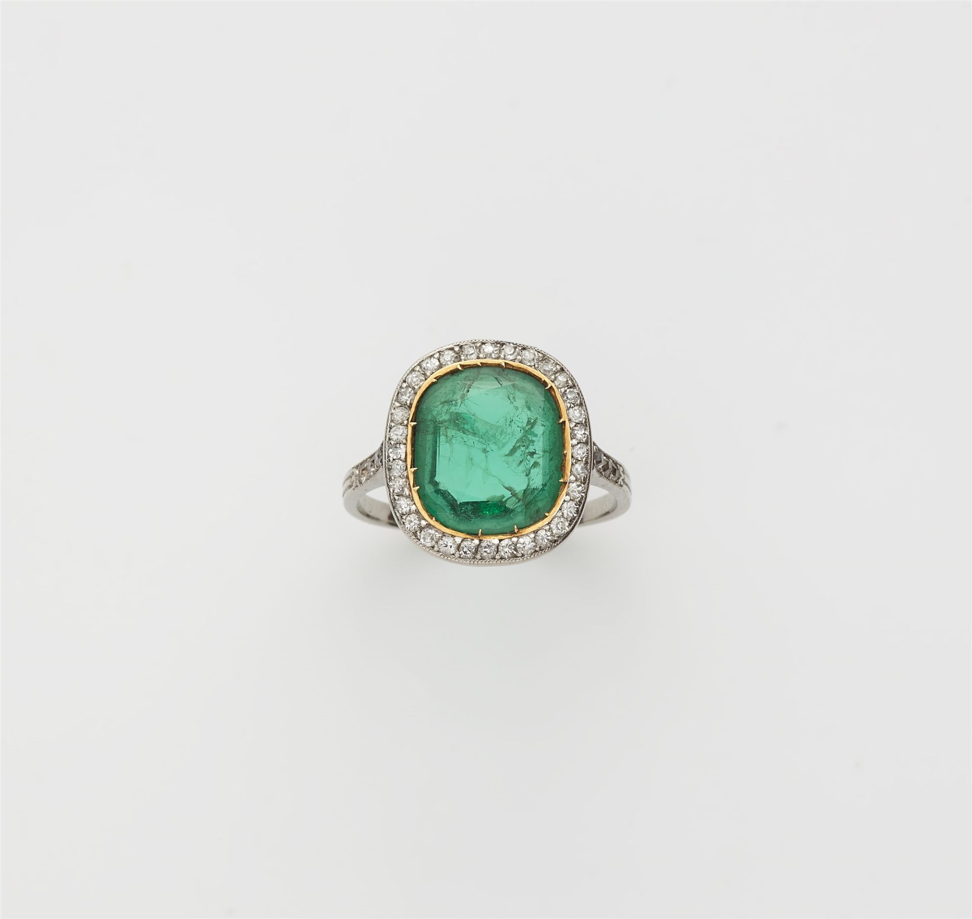 A French platinum, diamond and Colombian emerald Belle Epoque ring.