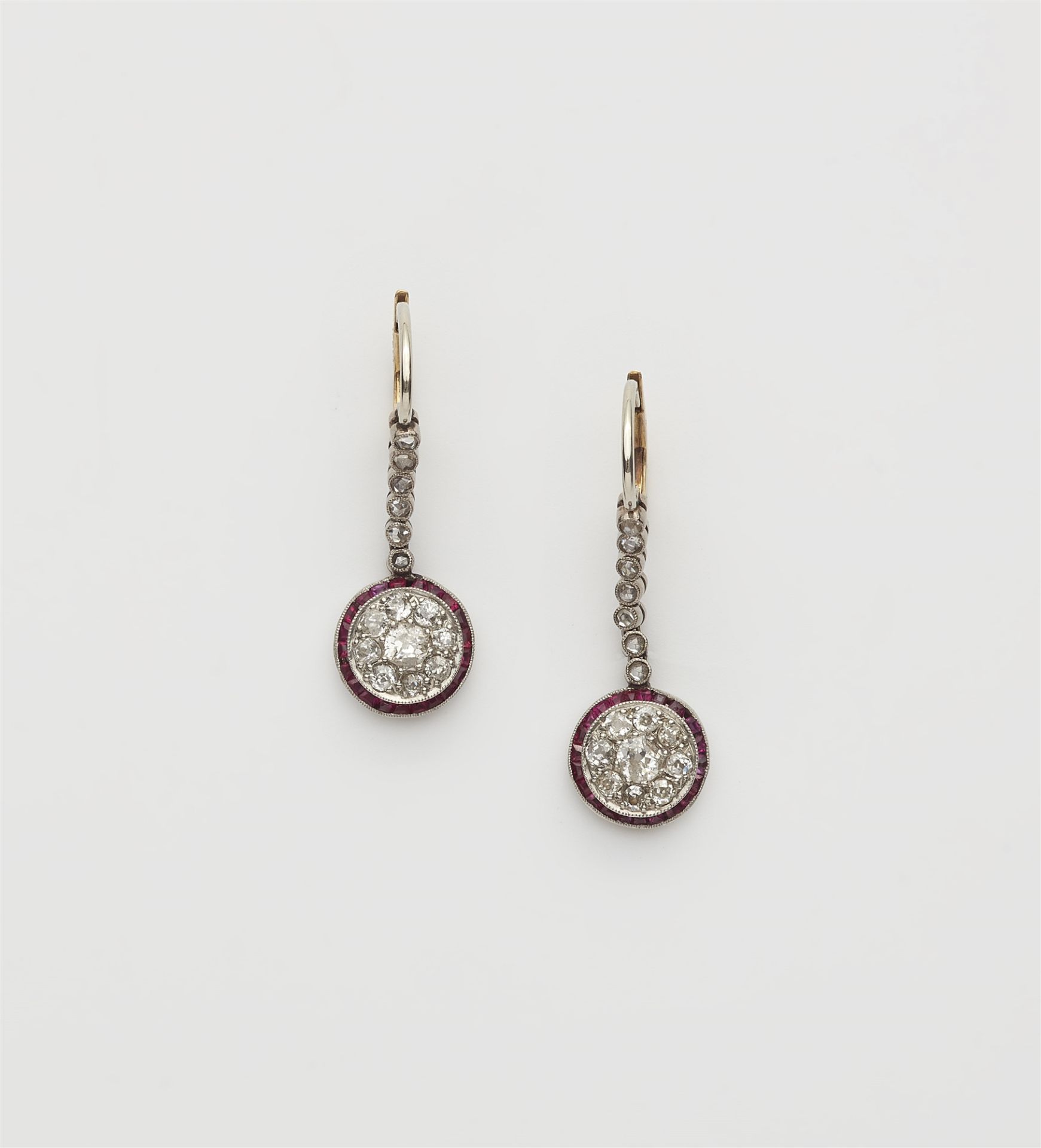A pair of platinum 14k gold diamond and ruby Belle Epoque earrings.