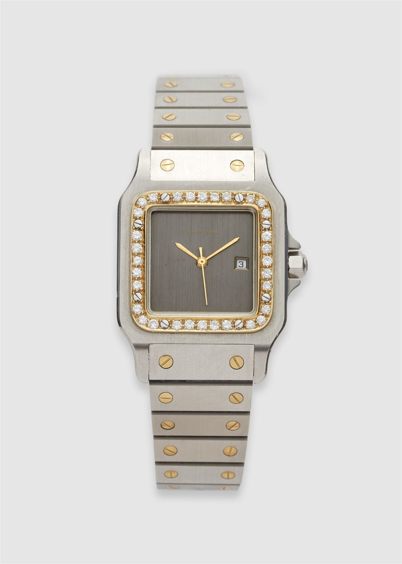 An 18k yellow gold and stainless steel automatic Cartier Santos Galbée gentleman´s wristwatch.