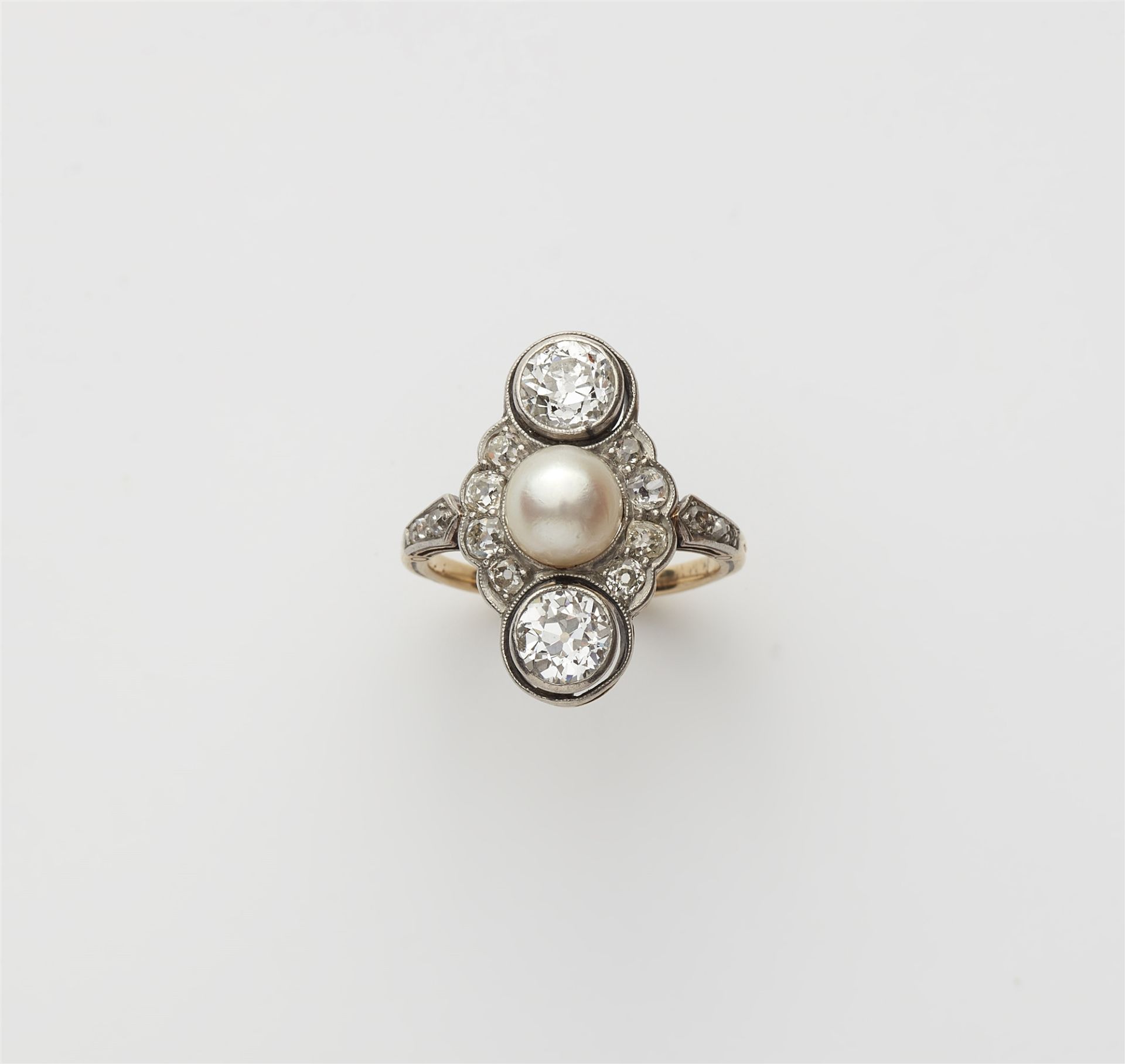 A platinum 14k gold diamond and natural pearl Belle Epoque ring.