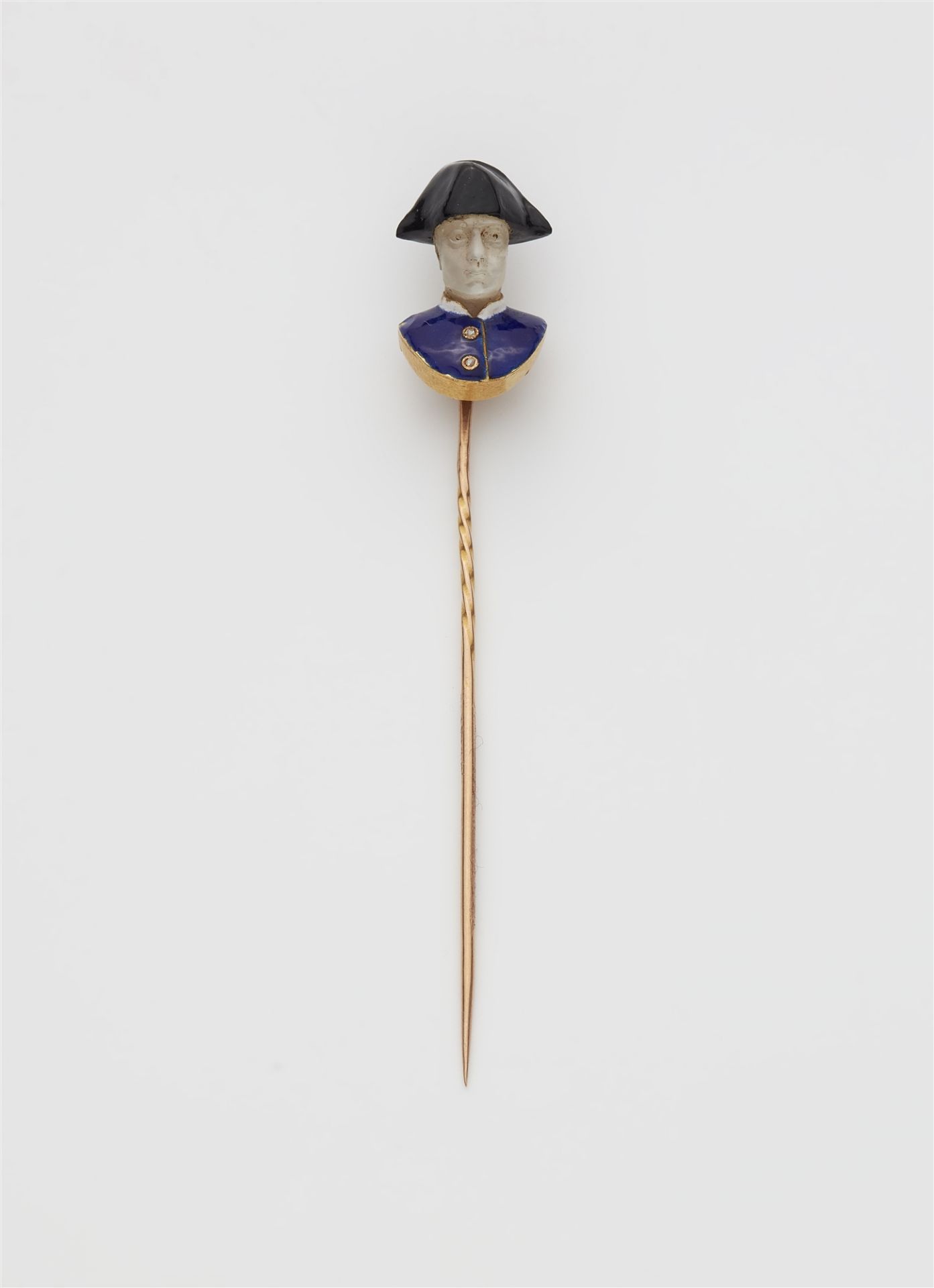 A 19th century 18k gold enamel and carved moonstone souvenir pin with bust of Napoleon Bonaparte.