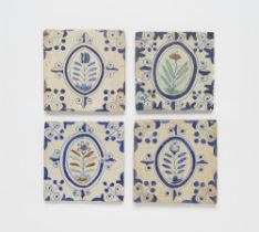 Four Dutch faience tiles with floral decor