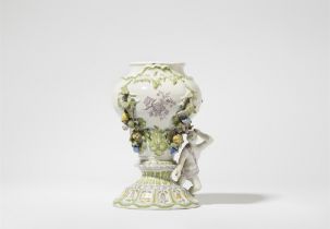 A faience vase with applique decor