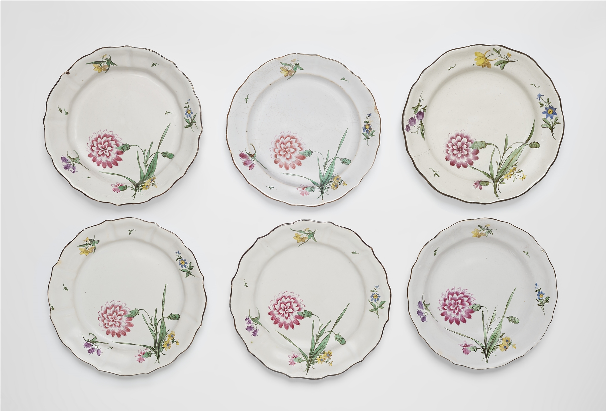 Six plates with carnation motifs