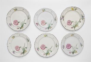 Six plates with carnation motifs