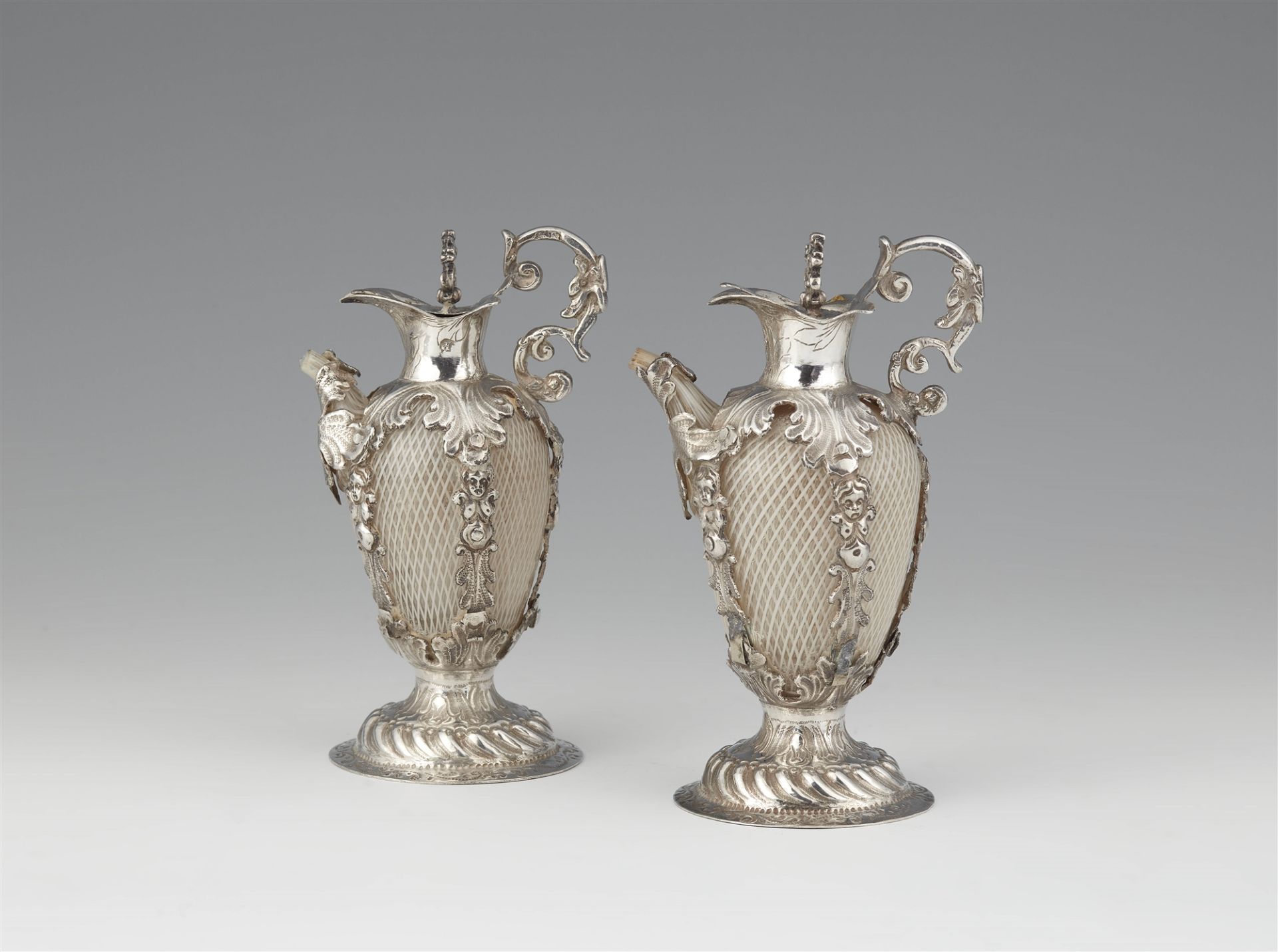 A pair of Venetian silver-mounted ewers in a fitted case