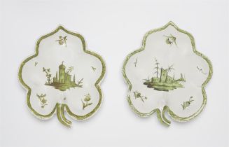 A pair of Proskau faience leaf rim dishes with architectural motifs