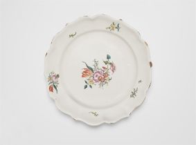 A Sulzbach faience plate with a small bouquet