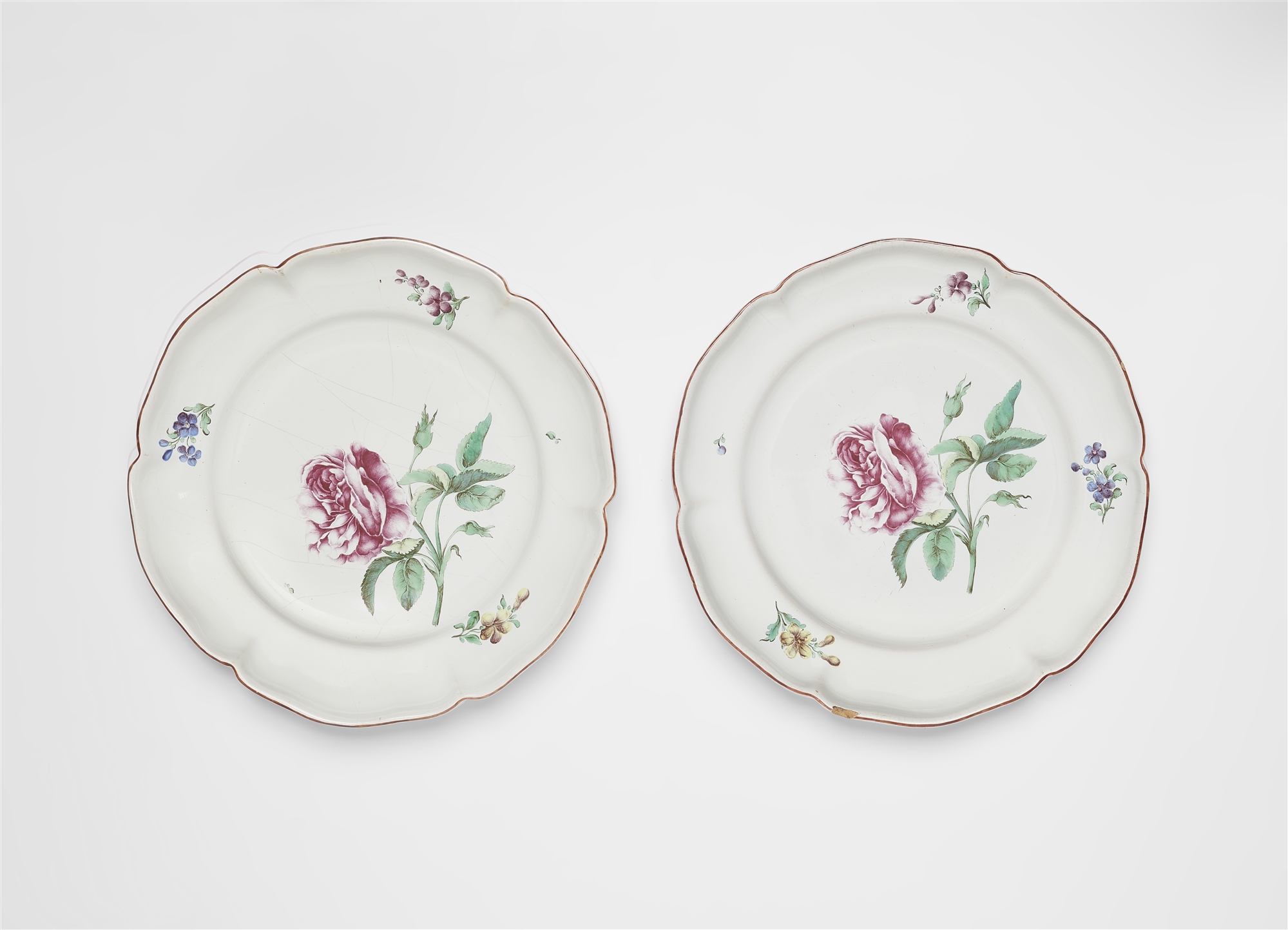 A pair of Strasbourg faience plates with 'fleurs fines' decor