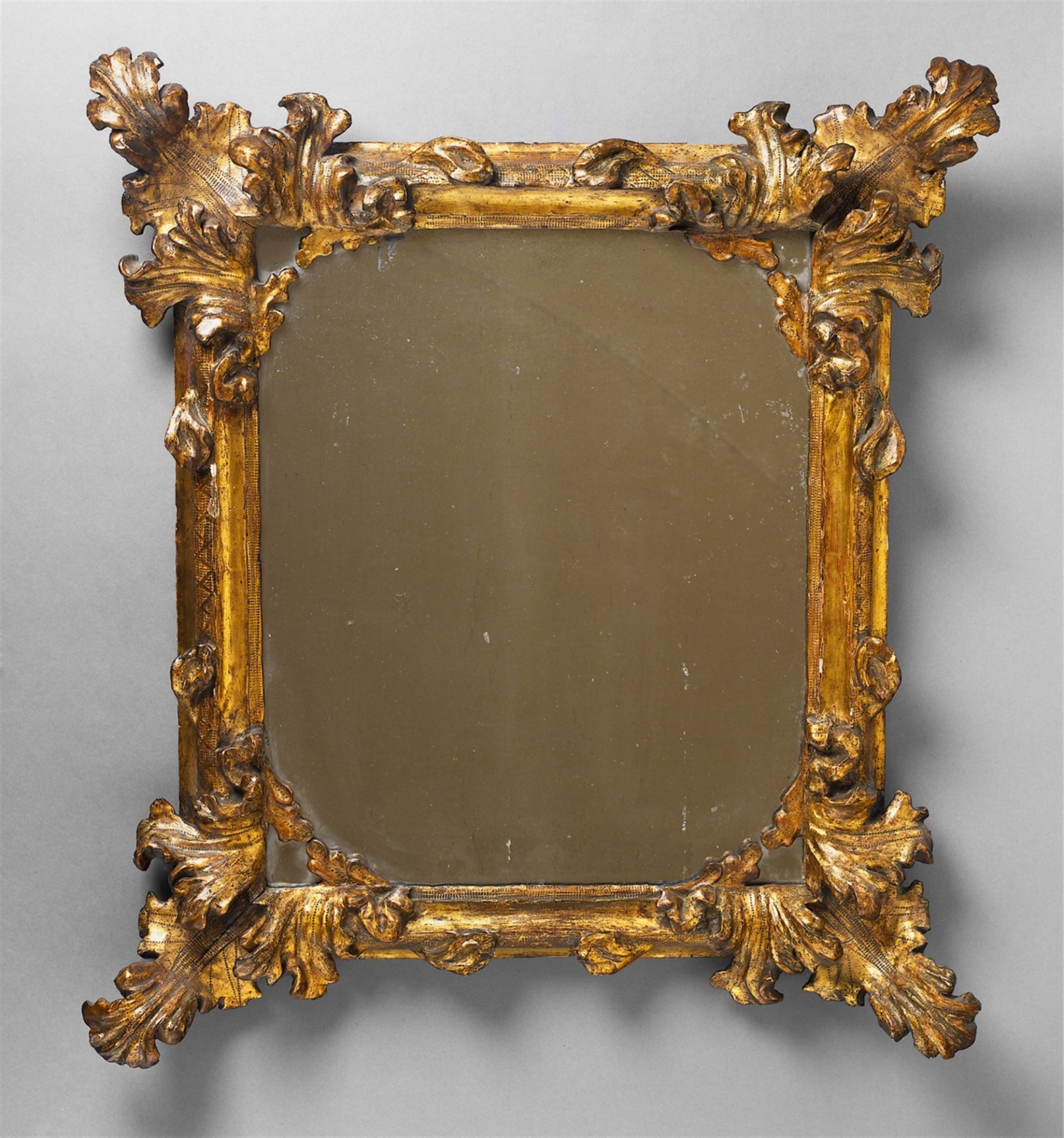 A carved gilt softwood Baroque frame with later mirror glass