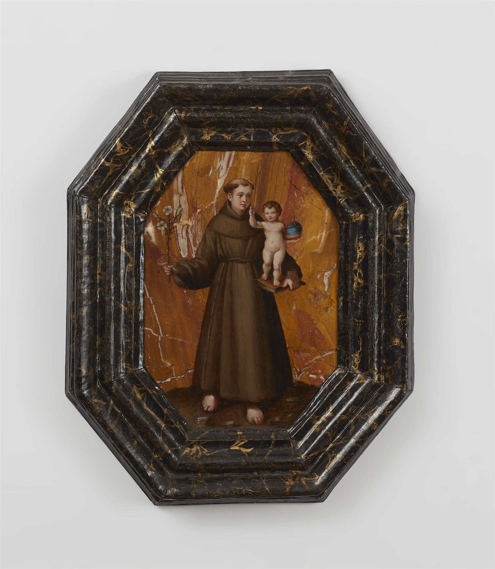 An octagonal stone panel with St. Anthony