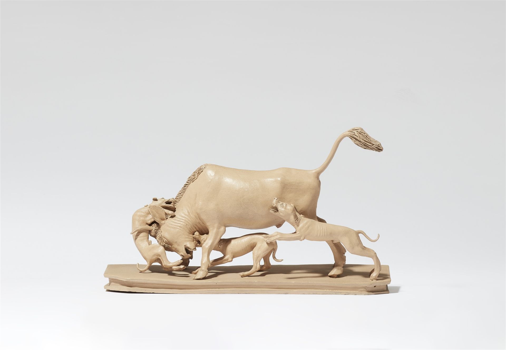 A terracotta sculpture of a bull hunt