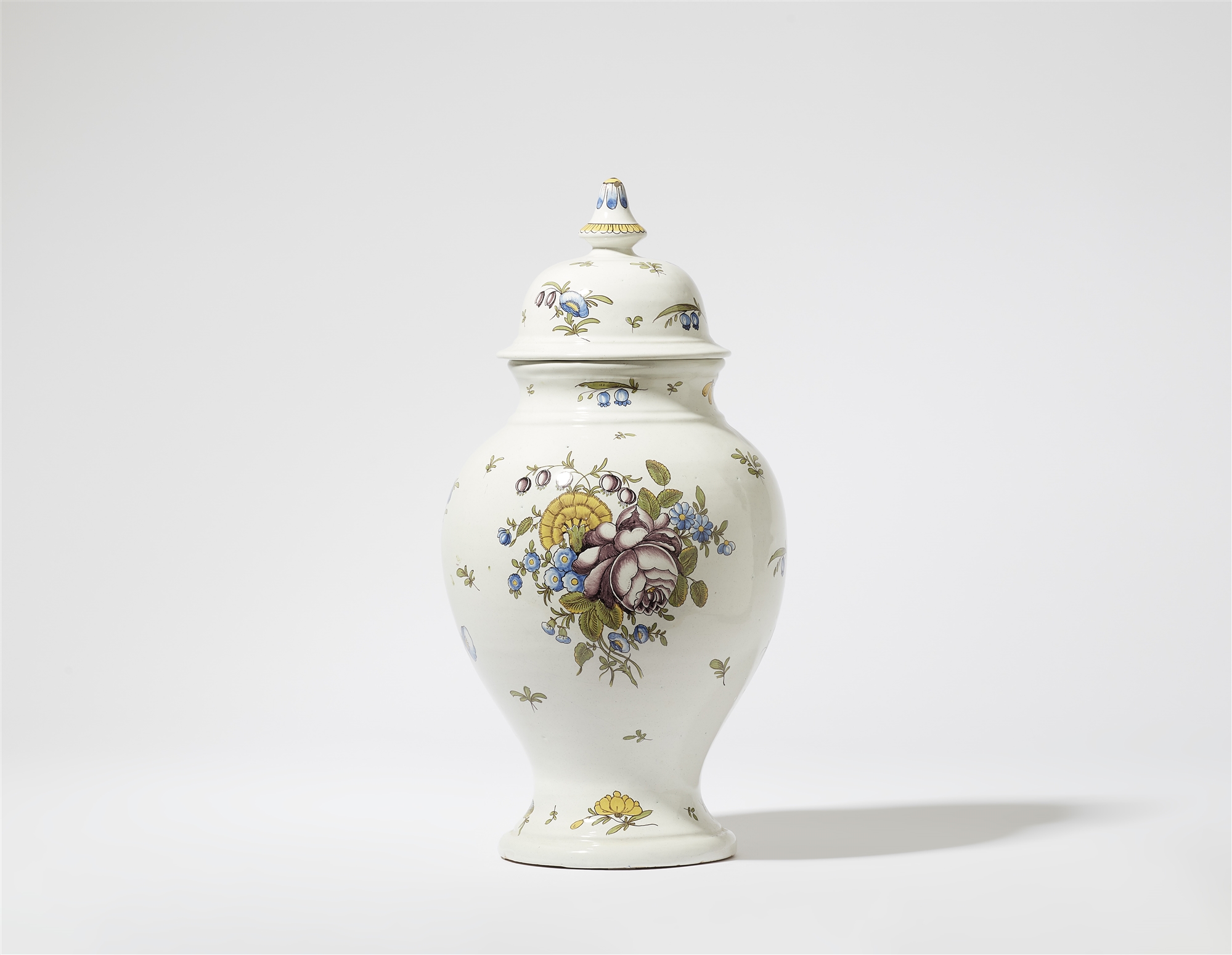 A faience vase with floral decor