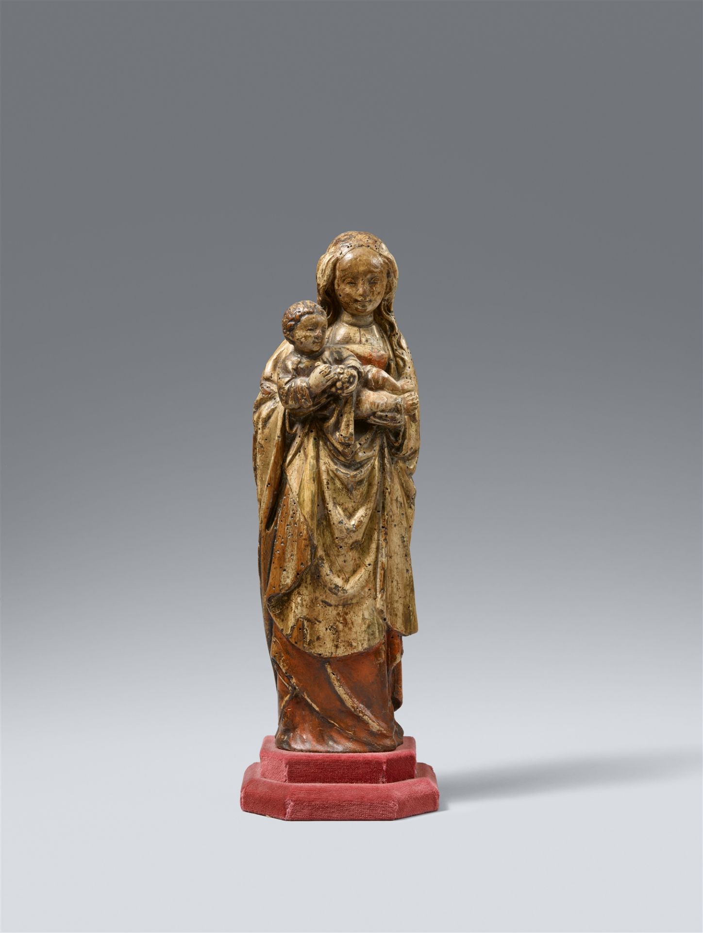 An early 16th century Mechelen carved figure of the Virgin and Child