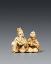 An ivory netsuke of a manzai dancer and his drummer. Second half 19th century