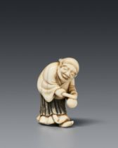 An ivory netsuke of a merrymaking man. First half 19th century