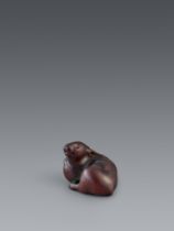 A wood netsuke of a chubby hare. 19th century