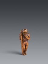 A large boxwood netsuke of oni no senbei. 18th/19th century