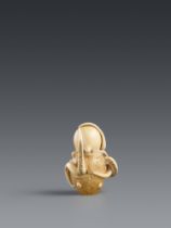 An ivory netsuke of an octopus trapped in a pot. Mid-19th century