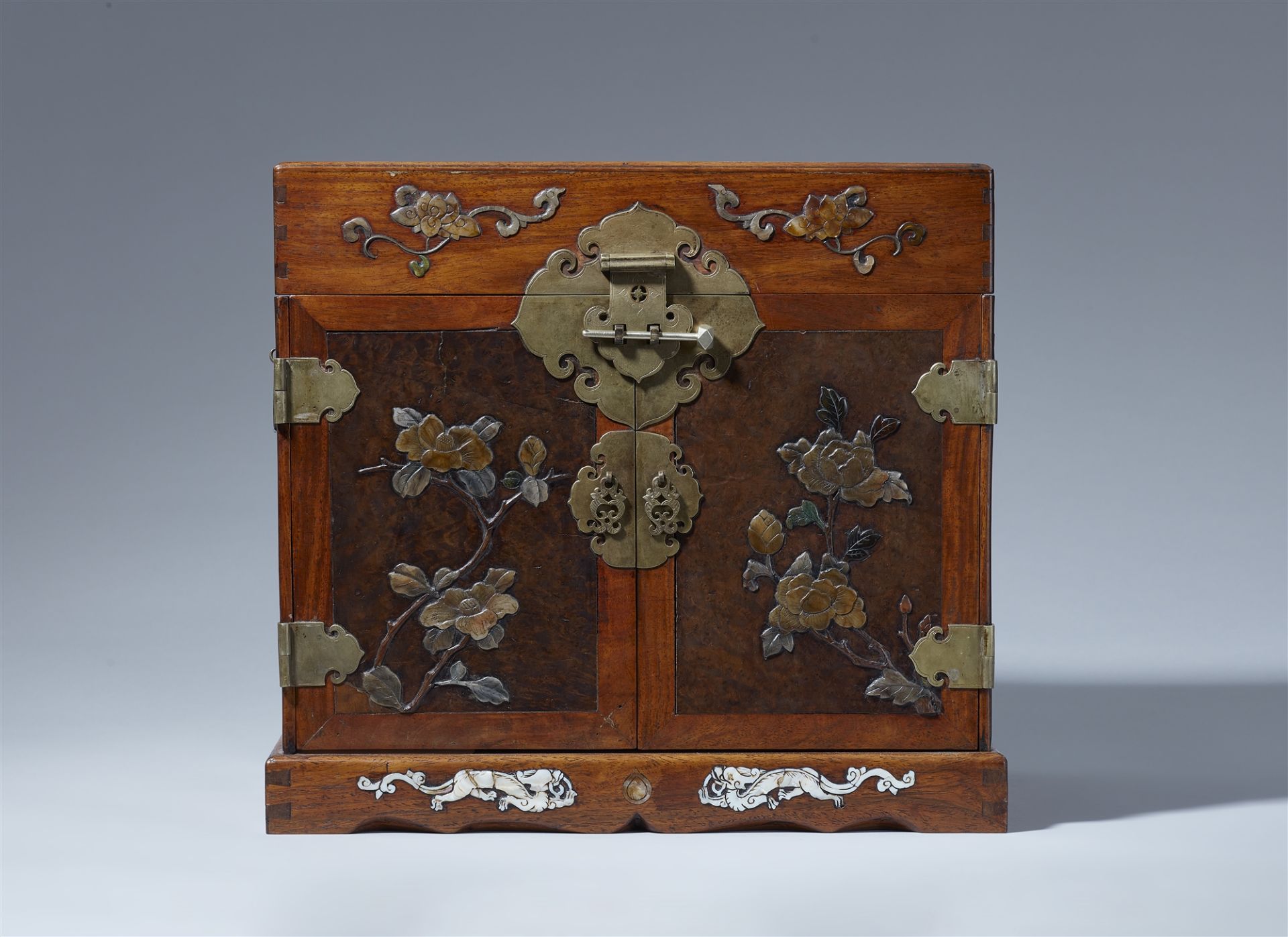 An inlaid huanghuali wood seal chest. 17th century