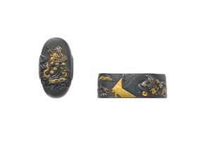 Fuchi-kashira. Shakudō. 19. Jh.