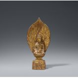 A gilt bronze figure of Buddha Shakyamuni. In the style of the Wei dynasty